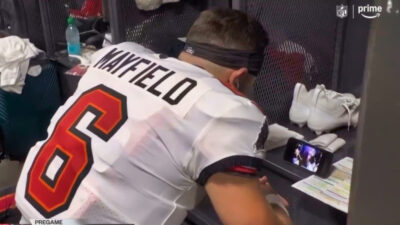 Baker Mayfield watching video on his phone