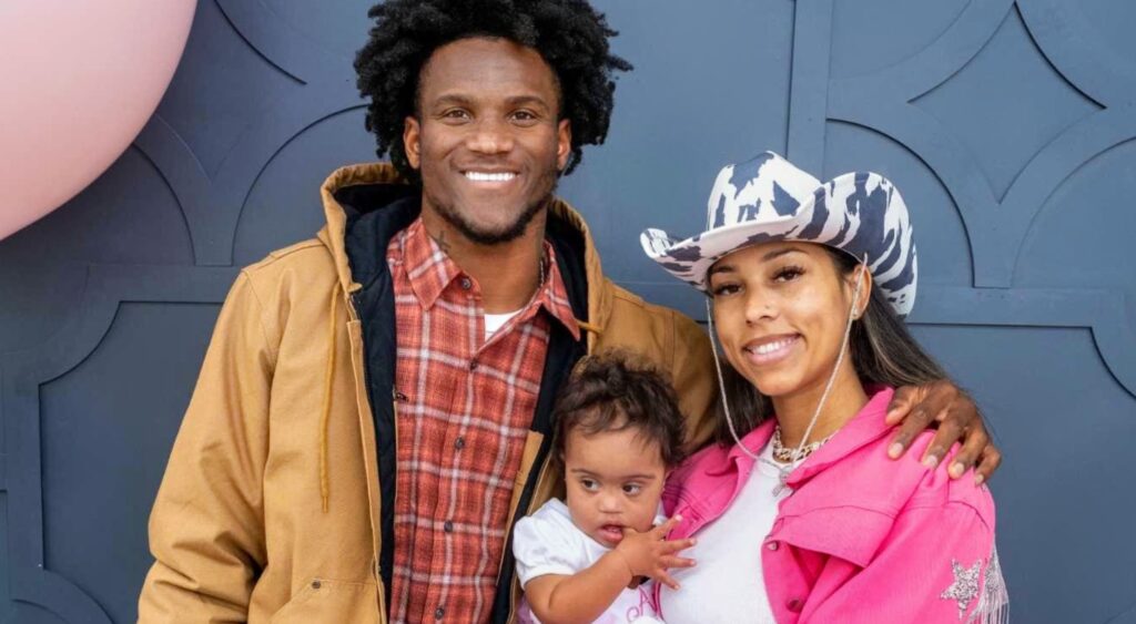 Charvarius Ward with his girlfriend, Monique Cook, and their daughter, Amani.