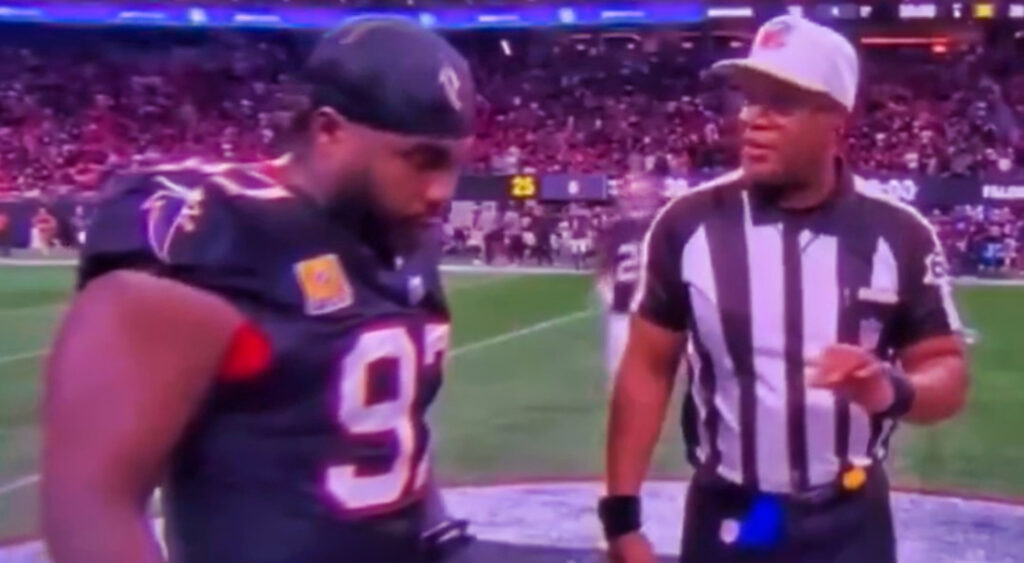 Atlanta Falcons player going through coin toss