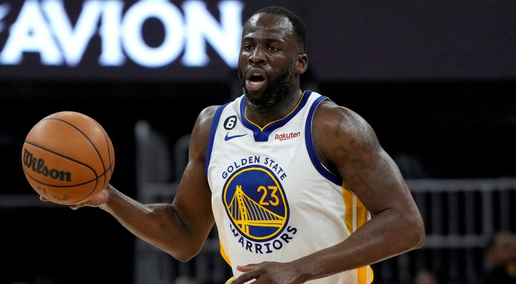 Draymond Green of the Golden State Warriors brings the ball up court during a NBA match