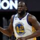 Draymond Green of the Golden State Warriors brings the ball up court during a NBA match