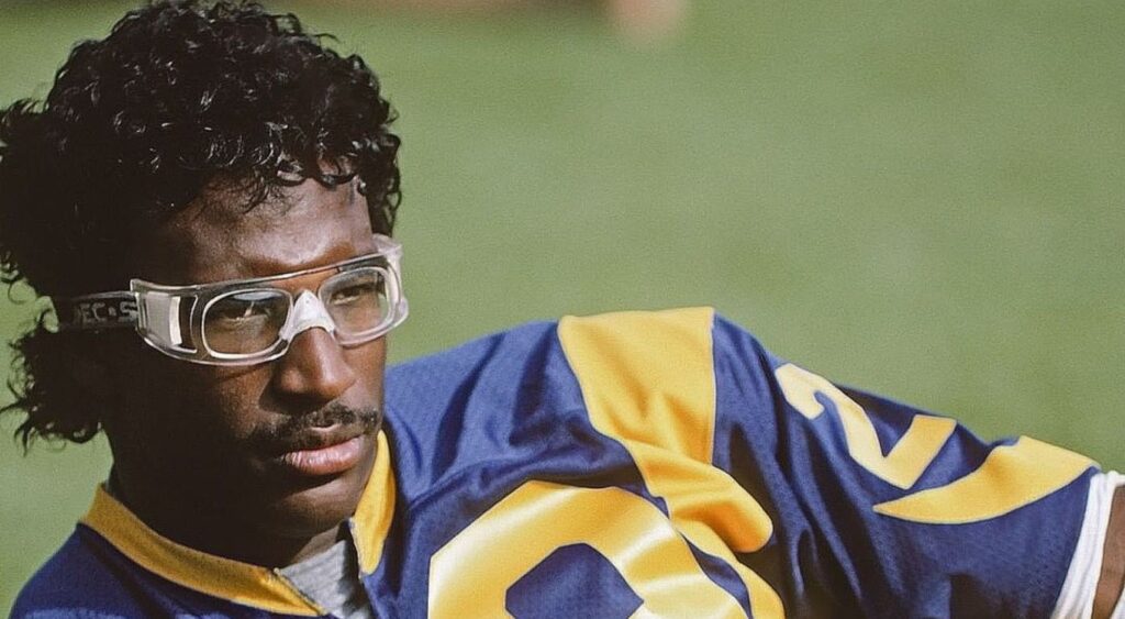 Eric Dickerson posing on-field