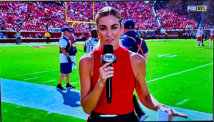 Erin Andrews speaking into microphone