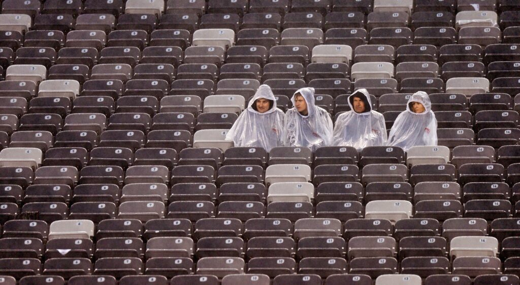 NFL fans sitting in rain. Steelers-Cowboys matchup could be affected by severe weather