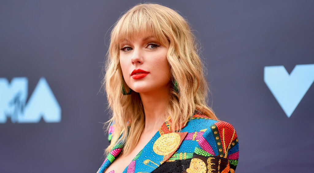 Taylor Swift wearing multi-colred outfit