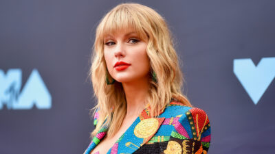 Taylor Swift wearing multi-colred outfit