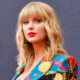 Taylor Swift wearing multi-colred outfit