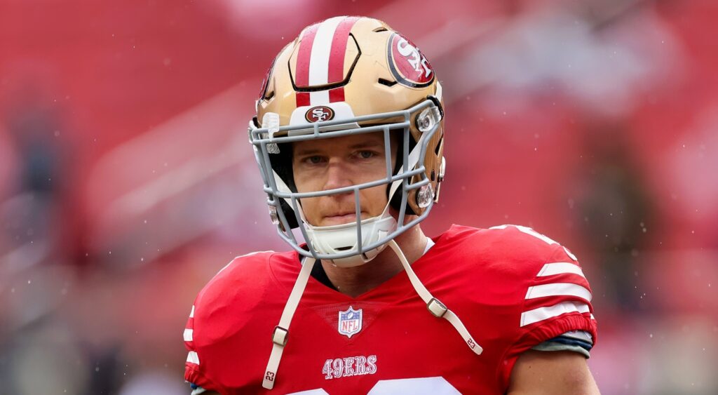 Christian McCaffrey of San Francisco 49ers looking on.