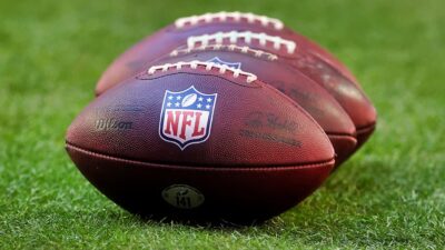 NFL Footballs on field