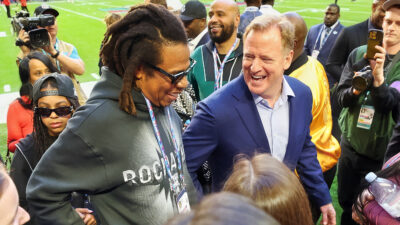 Roger Goodell laughing with Jay-Z