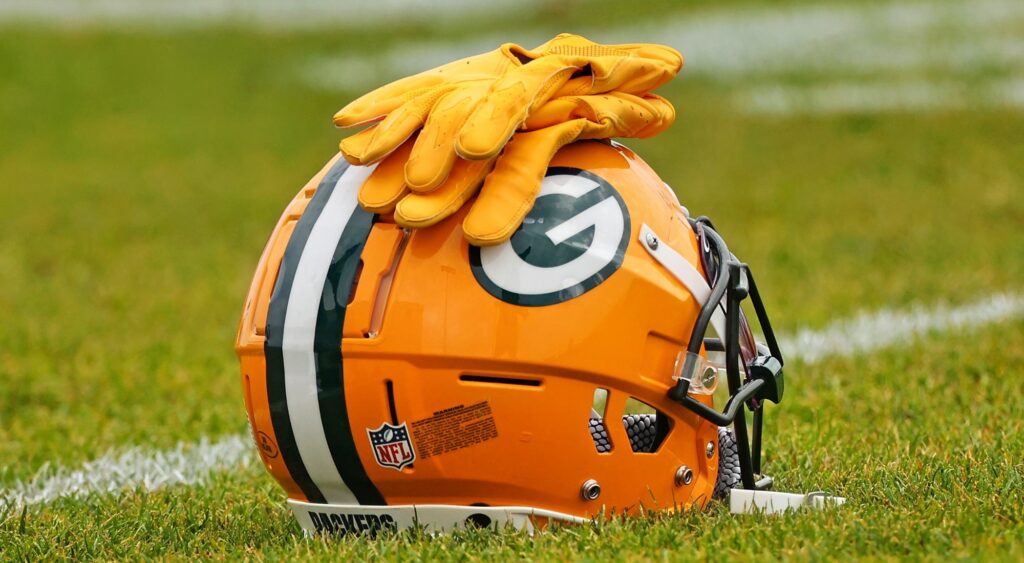 Green Bay Packers helmet shown on field. Romeo Doubs is reportedly unhappy with his role.