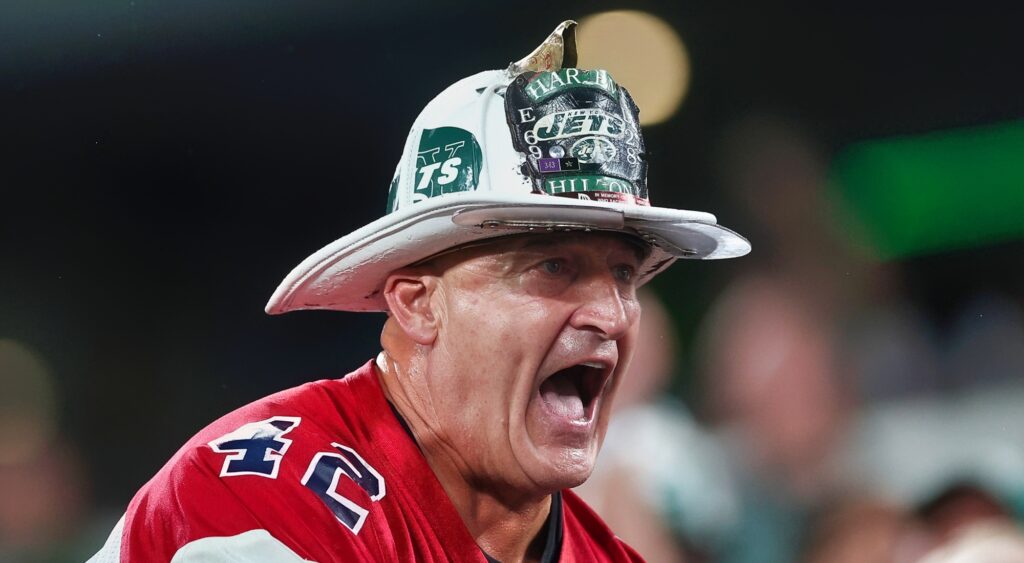 New York Jets fan "Fireman Ed" reacts during game.