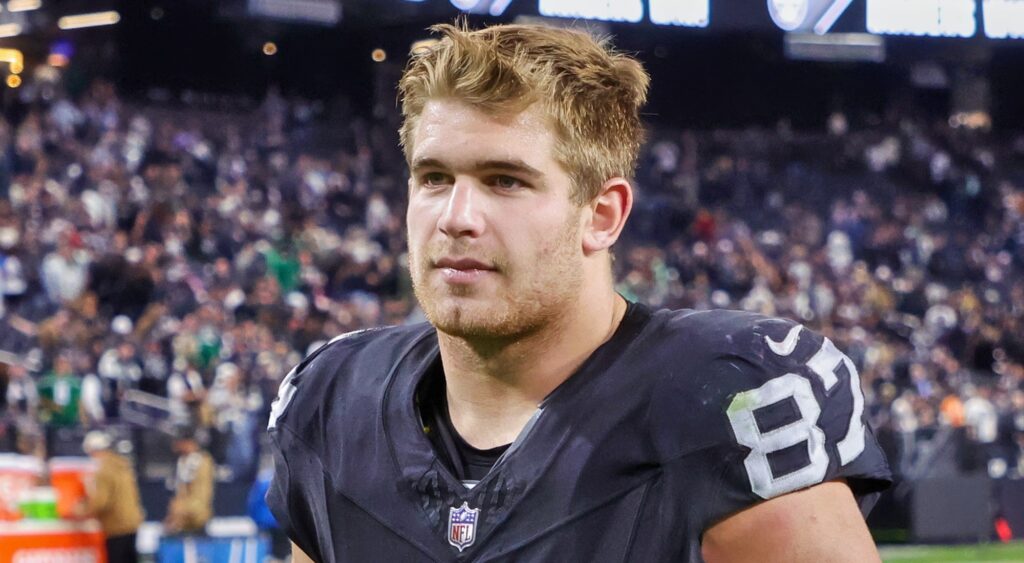 Las Vegas Raiders tight end Michael Mayer looking on. 