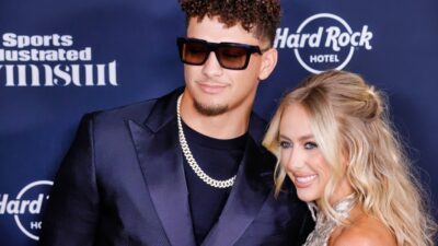 Patrick Mahomes and Brittany Mahomes posing