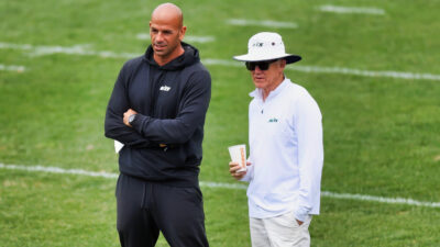 Robert Saleh standing next to Woody Johnson