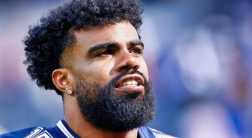 Ezekiel Elliott looks on.