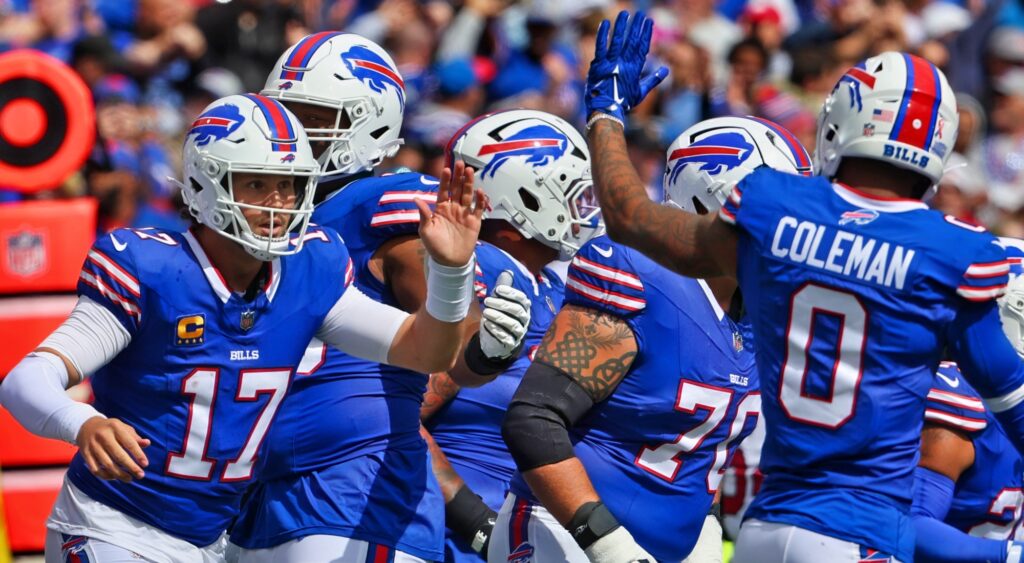 Buffalo Bills celebrating a touchdown. Wide receiver Marques Valdes-Scantling was released after they acquired Amari Cooper.