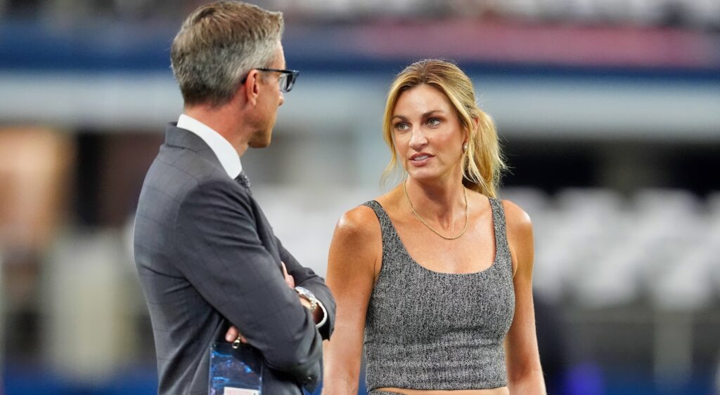 Kevin Burkhardt and Erin Andrews on the field before a game.