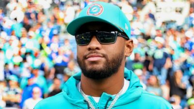 Tua Tagovailoa in sunglasses and Dolphins gear