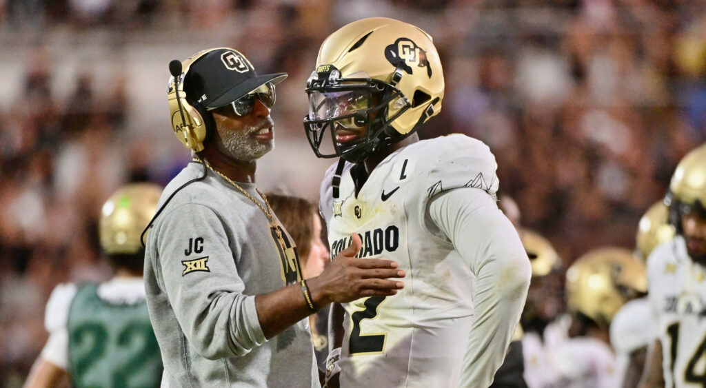 Deion and Shedeur Sanders during a college football game