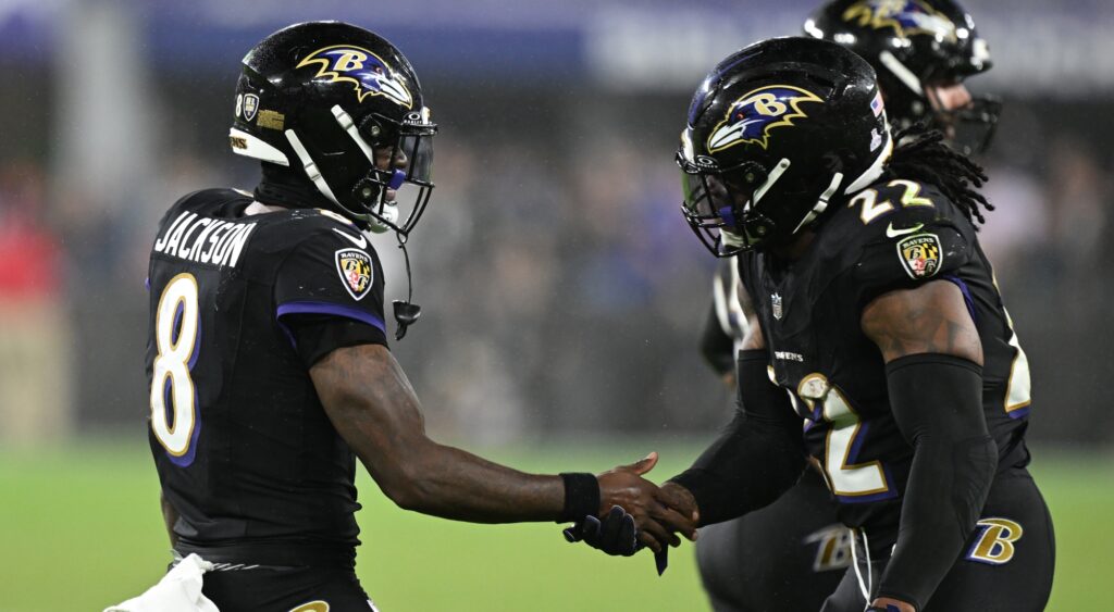 Lamar Jackson and Derrick Henry of Baltimore Ravens celebrating a play.