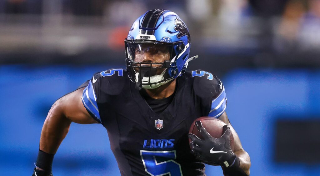 David Montgomery of Detroit Lions running with football.