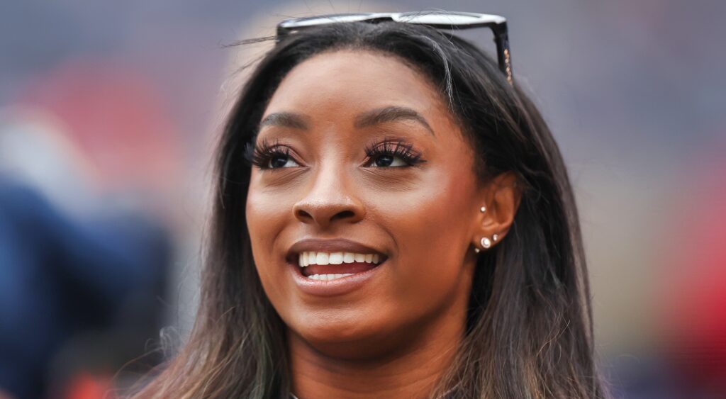 Simone Biles with sunglasses on head