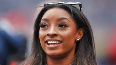 Simone Biles with sunglasses on head