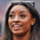 Simone Biles with sunglasses on head