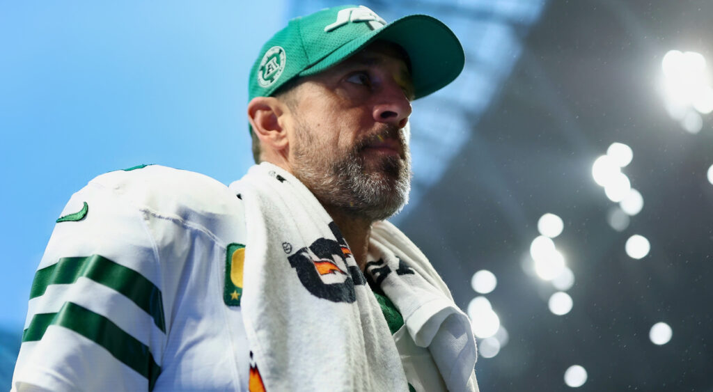 Aaron Rodgers wearing Jets gear