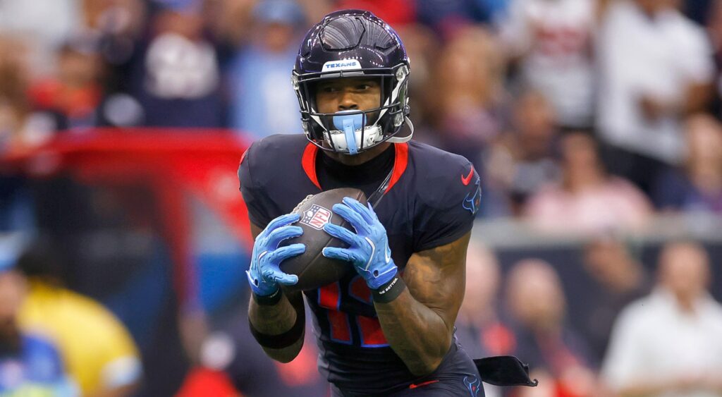 Nico Collins of Houston Texans running with football.