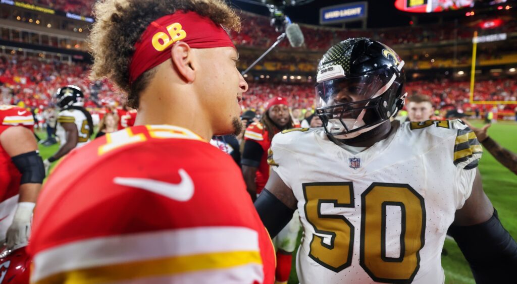 Khalen Saunders and PAtrick Mahomes shake hands after their game.