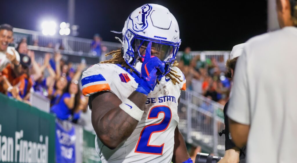 Ashton Jeanty pointing a finger up on the sideline.