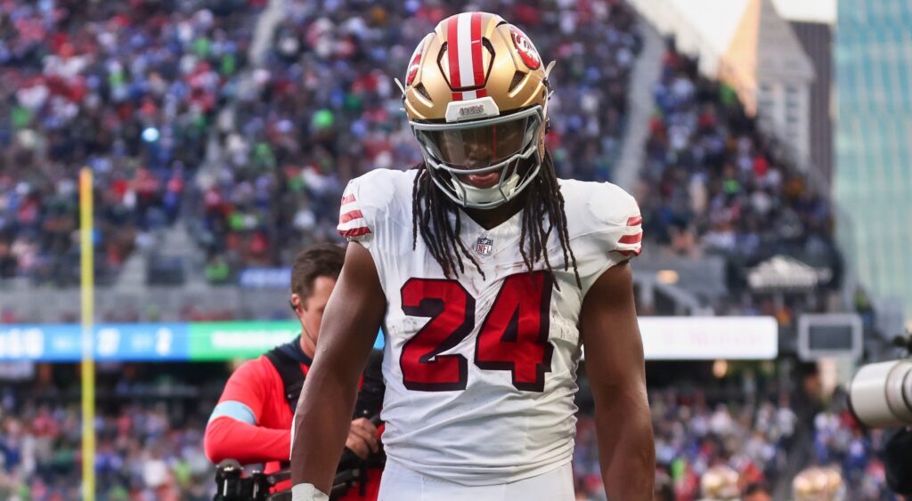 Jordan Mason in uniform on sidelines