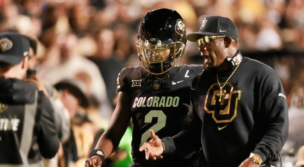 Deion and Shedeur Sanders during college football game