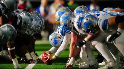 Dallas Cowboys and Detroit Lions players at line of scrimmage