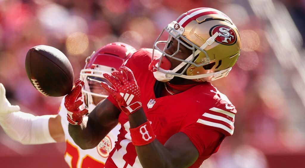 Brandon Aiyuk of San Francisco 49ers trying to catch a pass.