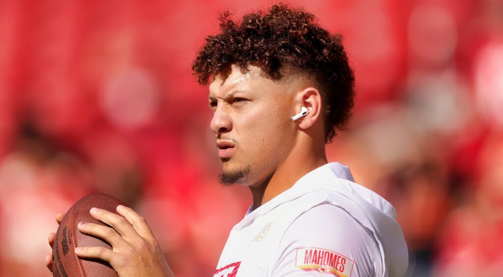 Patrick Mahomes holding football