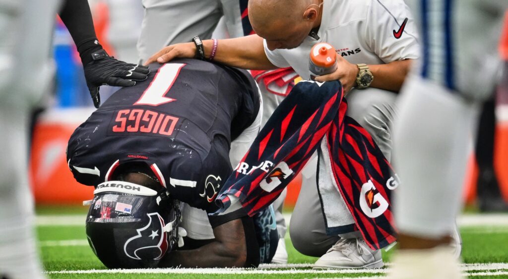 Stefon Diggs kneeling over on ground