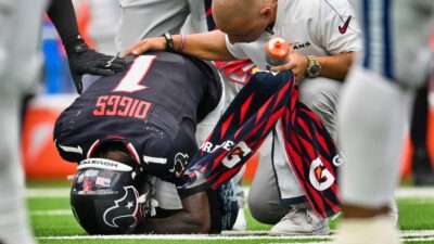 Stefon Diggs kneeling over on ground