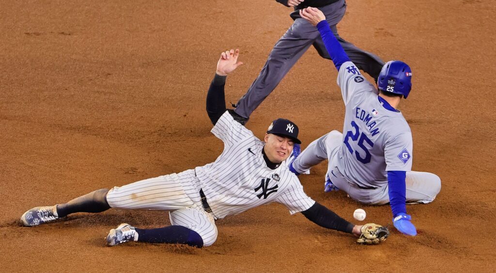 Anthony Volpe and Tommy Edman at base during 2024 World Series.