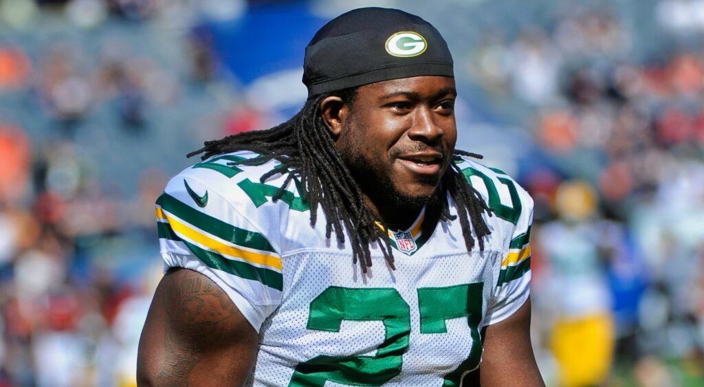 Eddie Lacy looks on with his helmet off.