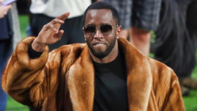 Diddy smiling and saluting