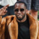 Diddy smiling and saluting