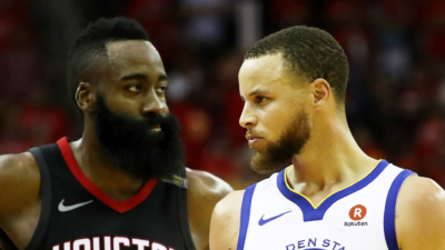 Stephen Curry of the Golden State Warriors reacts as James Harden of the Houston Rockets looks on in the third quarter of Game Seven of the Western Conference Finals of the 2018 NBA Playoffs