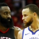 Stephen Curry of the Golden State Warriors reacts as James Harden of the Houston Rockets looks on in the third quarter of Game Seven of the Western Conference Finals of the 2018 NBA Playoffs