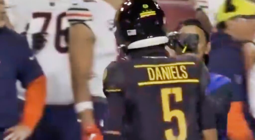 Jayden Daniels trash talking the Bears sideline.