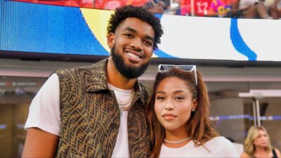 NBA athlete Karl-Anthony Towns and model Jordyn Woods attend the NFL game.