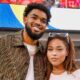 NBA athlete Karl-Anthony Towns and model Jordyn Woods attend the NFL game.