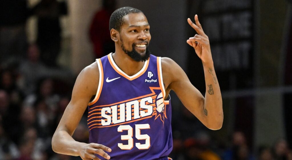 Kevin Durant of the Phoenix Suns celebrates making a three-point basket during a NBA match